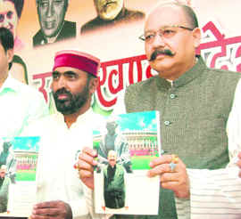 Satpal Maharaj, MP from Pauri Garhwal, releases a book in Dehradun on Sunday.