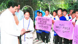 Chief Minister Ramesh Pokhriyal Nishank meets students from Arunachal Pradesh in Dehradun on Sunday.