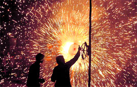 People burn crackers to celebrate Diwali in Gurgaon on Friday.