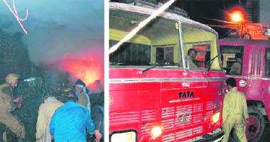 (Left) Firemen douse fire at a hosiery shop; and a fire engine stuck in a narrow lane leading to Mochpur Bazaar in Ludhiana