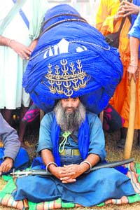 Baba Balwant Singh, member of a Nihang outfit, wears a 700m, 60 kg turban on Fateh Diwas