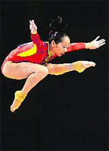 Chinas Deng Linlin performs during the womens beam final at the Gymnastic World Championships in London 