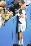 Nikolay Davydenko kisses his wife Iriana after winning the men's singles final at the Shanghai Masters tennis tournament