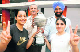 Winners of cycling championship with their trophy in Patiala on Monday.