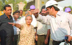 Delhi Chief Minister Sheila Dikshit along with PWD minister Raj Kumar Chauhan inspects the construction of Barapullah elevated road in New Delhi on Monday. 