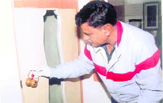  Forensic expert Ravinder Pal lifts a sample from a crime spot in Bhiwani.