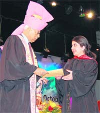 Governor NN Vohra awards a degree and a medal to a student at the 17th annual convocation of Kashmir University in Srinagar
