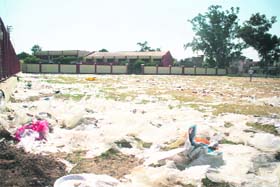 Heaps of polythene left by cracker sellers during Diwali on the Dusshera ground in Gandhi Nagar, Jammu