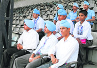 Students of Hargobind Public School, Thakkarwal, wait for their vehicle at Guru Nanak Stadium, Ludhiana.