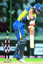 Cobras Andrew Puttick is bowled by Dirk Nannes on Monday.