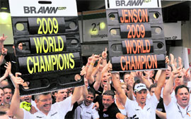 Ross Brawn (L), owner of Brawn GP, and his driver Jenson Button (R), celebrate their wins at the end of Brazil's Formula 1 GP in Sao Paulo on Sunday.