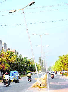 A bent streetlight pole on the road separating Sectors 55 and 56 in Chandigarh.