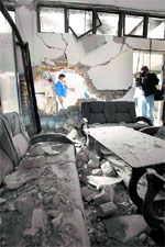 Pakistani mediapersons at the site of suicide bombings in Islamic University in Islamabad on Tuesday.