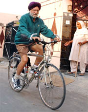 Riding past difficulties: Mark Roy on his bicycle.
