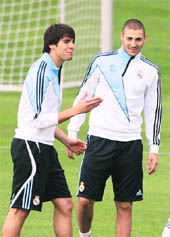 Real Madrids Kaka (L) and Karim Benzema during a training session in Madrid on Tuesday. 