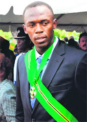 Triple record holder, Jamaicas sprinter Usain Bolt, is pictured with the Order of Jamaica, the country's fourth- highest honour, after being decorated in Kingston on Monday. 