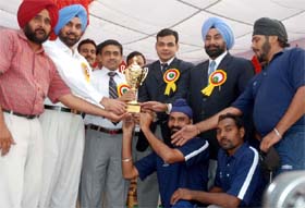 The Bathinda police team receiving the overall trophy of the 9th Police Faridkot Range Games from the chief guest Paramjeet Singh Gill, IG, Patiala zone, in Bathinda