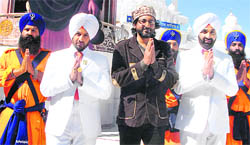Punjabi singers Jazzy B and Sukhshinder Shinda along with director Jagmeet Bal during a shoot for a religious album near Mullanpur on Wednesday.
