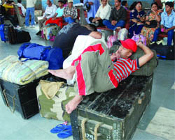 Stranded passengers wait at Nizamuddin railway station for their train in New Delhi on Wednesday as some trains were delayed due to the accident.