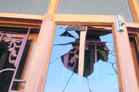 A damaged windowpane of the house