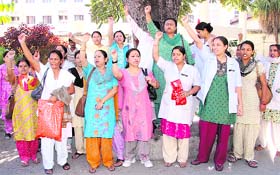 Government nurses hold a protest in support of their demands at the Doon Hospital