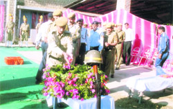 Police personnel paying tributes to police martyrs on the Martyrdom Day at Police Lines in Hamirpur 