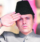  Chief Minister Omar Abdullah takes a salute at the police headquarters at Zewan on the outskirts of Srinagar;