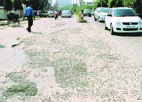 This road near Mintgumri Chowk in Model Town, which was partially recarpeted is now full of potholes, making it dangerous for vehicles