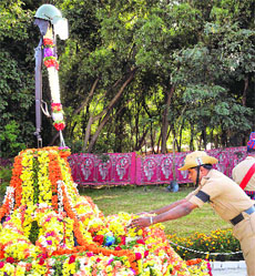 A policeman pays tributes to martyrs on Police Commemoration Day in Chikmagalur on Wednesday.