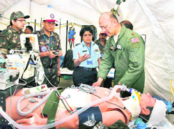 The rapid action management team of doctors of the Indian and the US Air Forces treats a wounded patient on the third day of Cope India 09, an Indo-US joint exercise, in Agra on Wednesday.