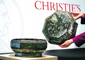 An octagonal inlaid mother-of-pearl lacquer box and cover from China's Yuan dynasty (1279AD-1368AD) is displayed at Christie's auction preview in Hong Kong