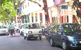 Wrongly parked vehicles on the road in front of Mehfil restaurant in Sector 17.