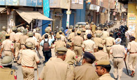 Policemen try to control protesters demonstrating against the Congress candidate from the Ballabgarh Assembly seat in Faridabad, Sharda Rathod, on Thursday.