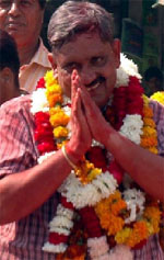 Winner Sukhbir Kataria (Independent) from the Gurgaon constituency greets residents at Sadar Bazar in Gurgaon on Thursday.