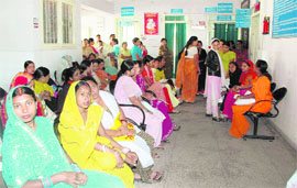 Patients wait outside the OPD following a strike by nurses in Doon Hospital on Thursday.