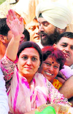 Congress candidate Sumita Singh greets supporters after winning the Karnal assembly seat on Thursday.