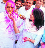 Former finance minister Sampat Singh of the Congress celebrates his victory in Nalwa with his family members.