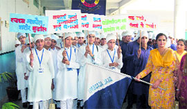 Indu Sharma, principal of Akal Academy, Ratia, flags off a rally of students for creating awareness on water and environment.