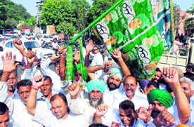 ecstatic INLD supporters outside a counting centre in Karnal after the initial gains were reported in poll results.