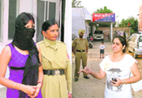 The con woman (left) in police custody with the complainant, Seema, at far right. A Tribune photograph