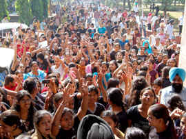 Girl students demonstrate on the Guru Nanak Dev University campus in Amritsar on Friday. 