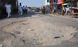A pothole at the main entrance of the Bathinda bus stand that has not been repaired for a long time now.