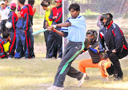A player in action during the softball match in Chandigarh on Friday.