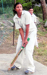 A girl cricketer practicing in Dehradun.