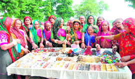 Gujarati women buy jewellery accessories in Haridwar.