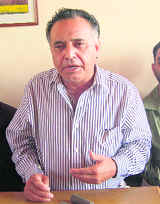 G.S.Bali, MLA of Nagrota Bagwan constituency, addressing a press conference at Dharamsala on Friday. 