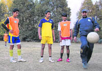Juan Marcos Troia with Kashmiri football players in Srinagar.