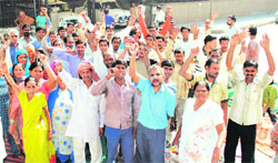 Members of the Safai Labour Union stage a protest at municipal corporations A-zone office in Ludhiana on Friday.