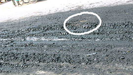 Marks of tyres on sewerage waste dumped on a road at Khanna.