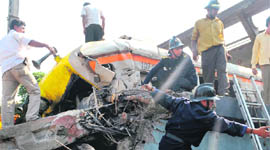 Rescue workers at the accident site in Mumbai on Friday.